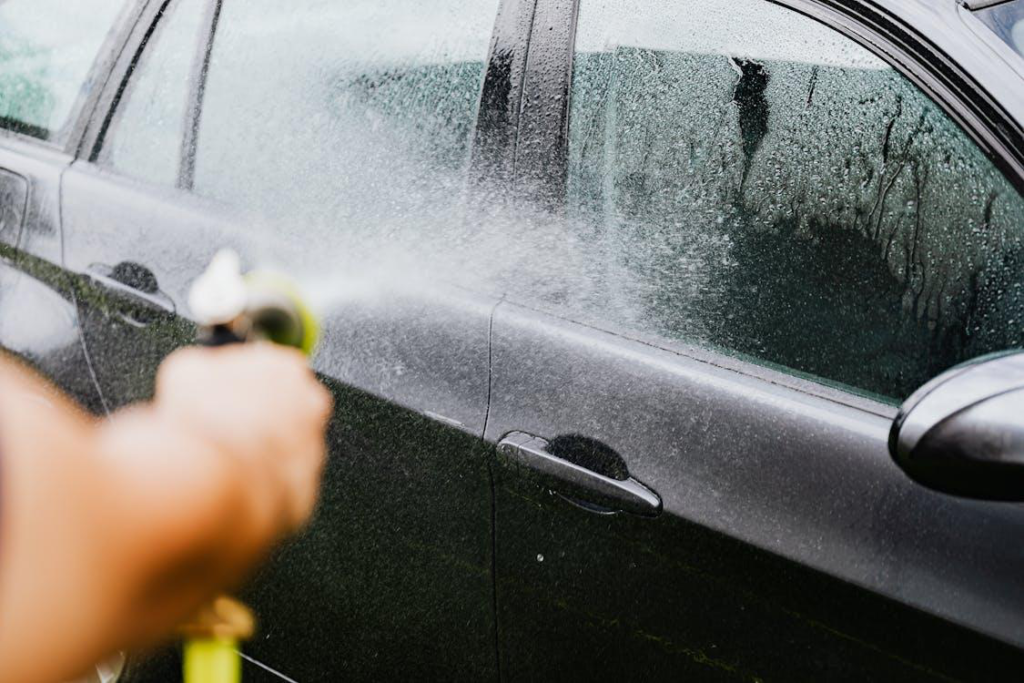 A car being sprayed with water during a car wash